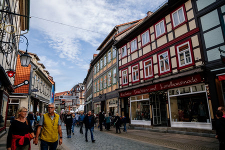 Wernigerode, Saxony-Anhalt, Germany, 29 October 2022: Historic old vintage colored timber frame houses in medieval town, UNESCO World Heritage city, half-timbered home at sunny autumn day, cobblestoneのeditorial素材