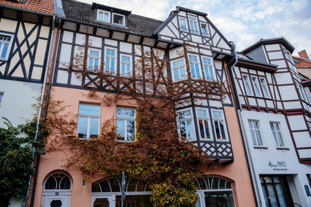 Wernigerode, Saxony-Anhalt, Germany, 29 October 2022: Historic old vintage colored timber frame houses in medieval town, UNESCO World Heritage city, half-timbered home at sunny autumn day, cobblestoneのeditorial素材