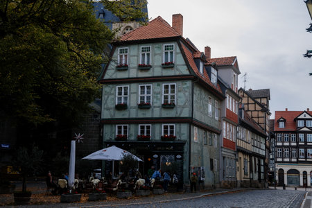 Quedlinburg, Saxony-Anhalt, Germany, 28 October 2022: Historic old vintage colored timber frame houses in medieval town, UNESCO World Heritage city, half-timbered home at sunny autumn day, cobblestoneのeditorial素材