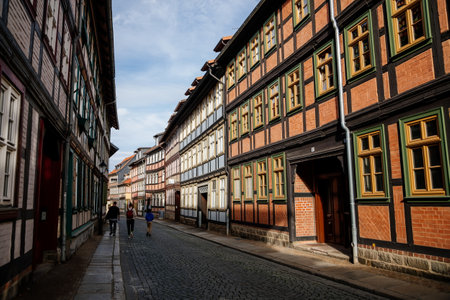 Wernigerode, Saxony-Anhalt, Germany, 29 October 2022: Historic old vintage colored timber frame houses in medieval town, UNESCO World Heritage city, half-timbered home at sunny autumn day, cobblestoneのeditorial素材