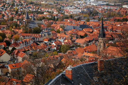 Wernigerode, Saxony-Anhalt, Germany, 29 October 2022: panoramic view of city from observation platform of castle, old houses with red tiled roofs, tower and spire of the church, sunny autumn dayのeditorial素材