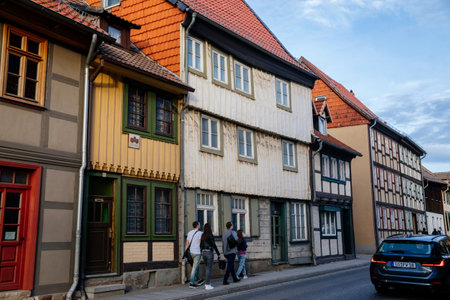 Wernigerode, Saxony-Anhalt, Germany, 29 October 2022: Historic old vintage colored timber frame houses in medieval town, UNESCO World Heritage city, half-timbered home at sunny autumn day, cobblestoneのeditorial素材