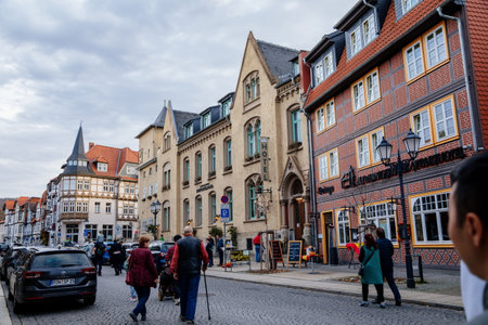 Wernigerode, Saxony-Anhalt, Germany, 29 October 2022: Historic old vintage colored timber frame houses in medieval town, UNESCO World Heritage city, half-timbered home at sunny autumn day, cobblestoneのeditorial素材