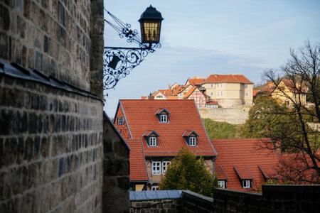 Quedlinburg, Saxony-Anhalt, Germany, 29 October 2022: Panoramic view of medieval city from castle observation platform, houses with red tiled roofs, sunny autumn day, vintage timber frame housesのeditorial素材