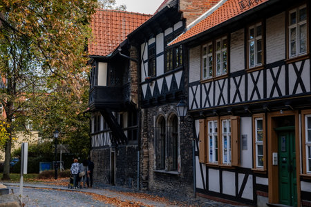 Wernigerode, Saxony-Anhalt, Germany, 29 October 2022: Historic old vintage colored timber frame houses in medieval town, UNESCO World Heritage city, half-timbered home at sunny autumn day, cobblestoneのeditorial素材