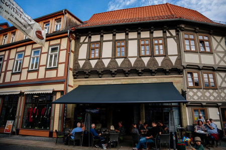 Wernigerode, Saxony-Anhalt, Germany, 29 October 2022: Historic old vintage colored timber frame houses in medieval town, UNESCO World Heritage city, half-timbered home at sunny autumn day, cobblestoneのeditorial素材