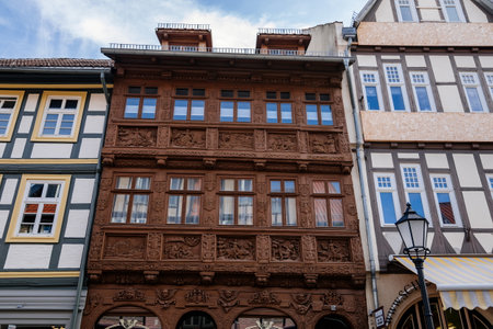 Wernigerode, Saxony-Anhalt, Germany, 29 October 2022: Krummelsches Haus or Krummel's house, Historic old vintage colored timber frame houses with carvings in medieval town, home at sunny dayのeditorial素材