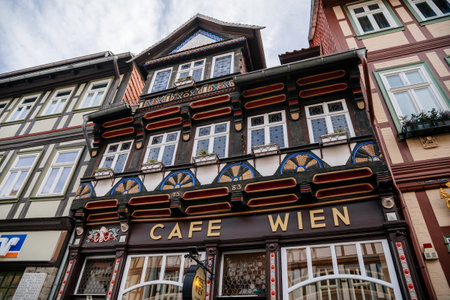Wernigerode, Saxony-Anhalt, Germany, 29 October 2022: Krummelsches Haus or Krummel's house, Historic old vintage colored timber frame houses with carvings in medieval town, home at sunny dayのeditorial素材