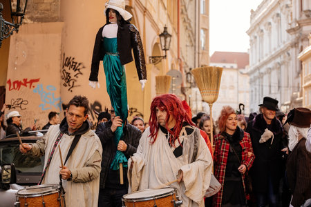 Prague, Czech Republic, 30 April 2023: Carodejnice festival or Walpurgis night, witch effigy is being carried to bonfire it will be burnt, spring welcoming ritual, Costumed men and women in streetsのeditorial素材