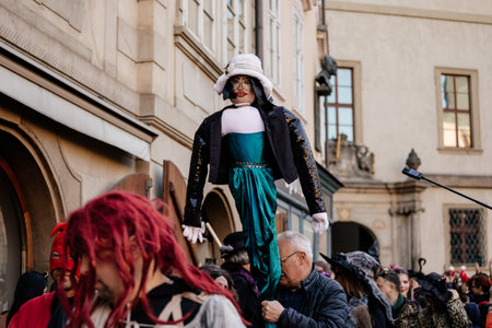 Prague, Czech Republic, 30 April 2023: Carodejnice festival or Walpurgis night, witch effigy is being carried to bonfire it will be burnt, spring welcoming ritual, Costumed men and women in streetsのeditorial素材
