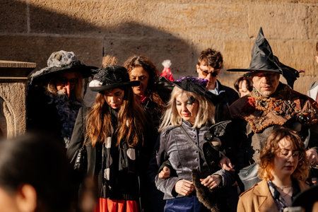 Prague, Czech Republic, 30 April 2023: Carodejnice festival or Walpurgis night, witch effigy is being carried to bonfire it will be burnt, spring welcoming ritual, Costumed men and women in streetsのeditorial素材