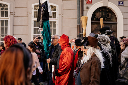 Prague, Czech Republic, 30 April 2023: Carodejnice festival or Walpurgis night, witch effigy is being carried to bonfire it will be burnt, spring welcoming ritual, Costumed men and women in streetsのeditorial素材