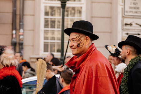 Prague, Czech Republic, 30 April 2023: Carodejnice festival or Walpurgis night, witch effigy is being carried to bonfire it will be burnt, spring welcoming ritual, Costumed men and women in streetsのeditorial素材