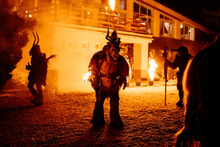 Trutnov, Czech Republic, 17 December 2022: Traditional show Zazij Krampus, parade of masks demonic...