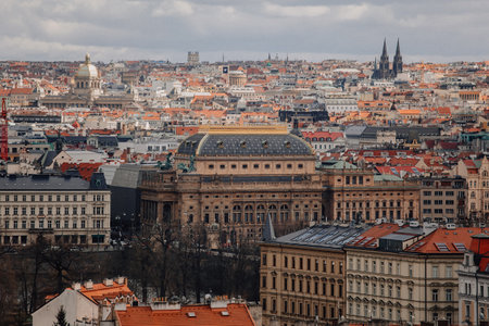 Prague, Czech Republic, 26 March 2023: Panorama of old town from Petrin Hill, Red roofs, Sunny spring day, Vltava river embankment, National Theatre, High spires gothic towers, urban landscapeのeditorial素材