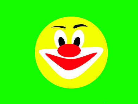 Round laughing face of a merry clown on a green backgroundの写真素材