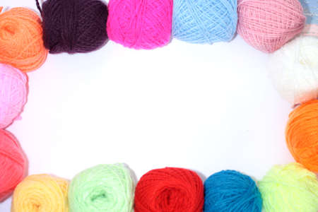 Colorful balls of yarn on the contour of the image on a white background.の写真素材