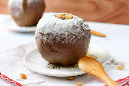 Baked apples stuffed with walnuts and raisins. Healthy food .の写真素材