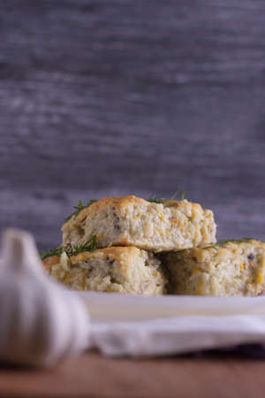 Zucchini casserole with rice. Vegetarian food. Pieces of casserole on a dark background. Copy spaceの写真素材