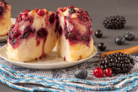 Tasty cottage cheese casserole with berries, cottage cheese pudding with berries. Appetizing fresh...