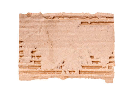 Close-up of torn cardboard on white background.の写真素材