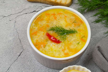 Deep plate of chicken rice soup on the table.の写真素材