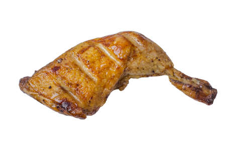 Grilled chicken leg with golden brown crust isolated on a white background.の写真素材
