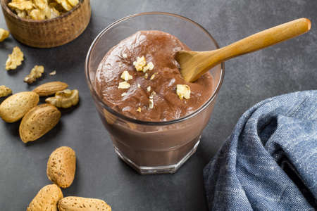 Chocolate pudding with different types of nuts.の写真素材