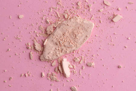 Face powder. Broken pieces of cosmetic powder. Cosmetic smear. Make up a crushed powder.の写真素材