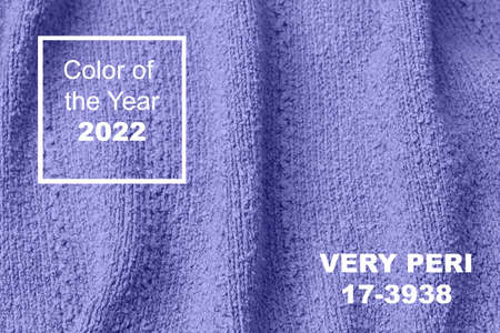 The texture of the knitted wool sweater in the trendy color of 2022 is very peri. Trendy soft very peri background for web design. Demonstrating color of 2022 year for fashion and clothing industry.の写真素材
