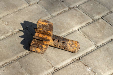 Rusty mortar shell on asphalt on a bright sunny day.の写真素材