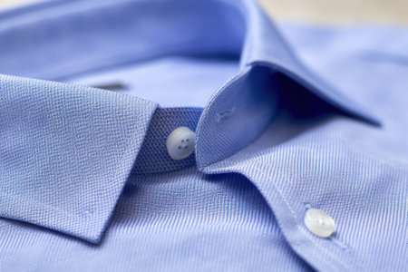 Close up of blue shirt with buttons. Shallow depth of field.の素材