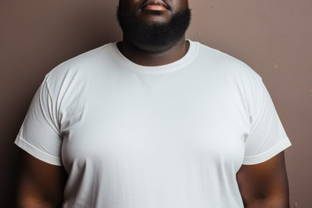 Cropped view of a man in a white t-shirt, focused on body positivityの素材