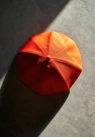 Scarlet Biretta of a Cardinal Resting on Stone, Symbol of Authority in the Papal Conclave.の写真素材