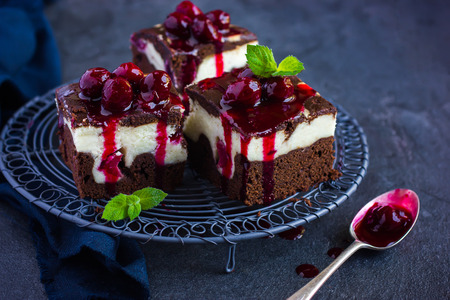 cheesecake brownies  with cherry sauce, selective focusの写真素材