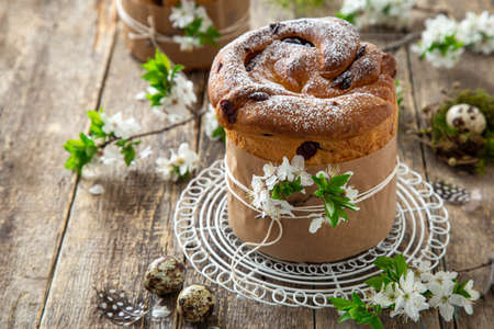 Traditional Orthodox Easter bread Kulich,  rustic wooden background, selective focus