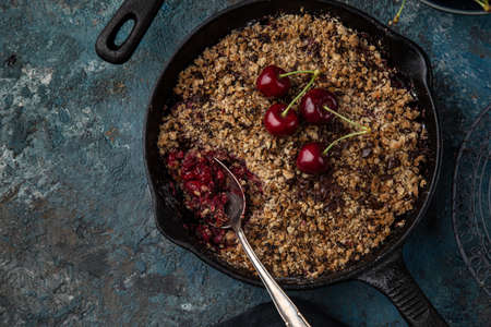 cherry and chocolate crumble pie on cast iron pan, top view