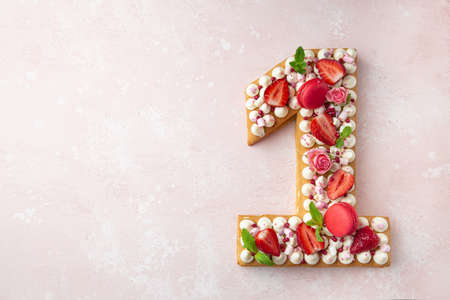 Number 1 naked honey cake for Birthday, pink background, top view, copy space