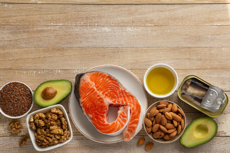 food sources of unsaturated fatty acids, omega 3 and vitamin D products, concept of healthy eating and cooking. Wooden background, top view, copy spaceの写真素材