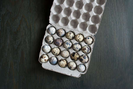 Quail eggs in a cardboard box. Eco-product in environmentally fr