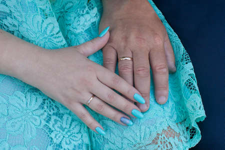 The hands of the bride and groom with ringsの写真素材