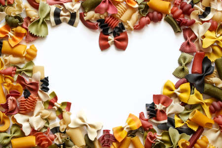 Mix of red pasta, laid out in the form of heart. Mock upの写真素材