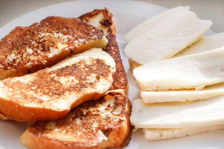 Delicious toast with slices of homemade cheese for Breakfastの写真素材