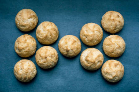 round homemade cookies, laid out in a bow tie on a blue backgroundの写真素材