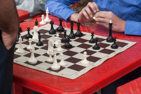 A chess game between a young student and a teacherの写真素材