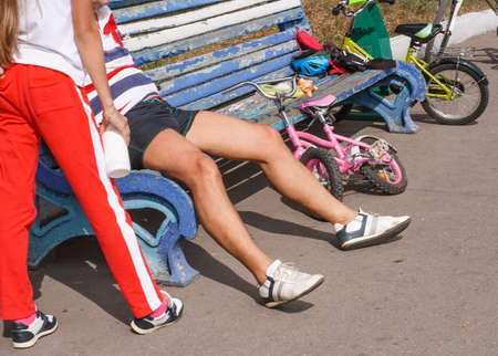 A sports family rests after a bike rideの写真素材