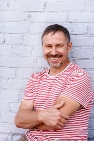 A middle-aged man with a charming smileの写真素材