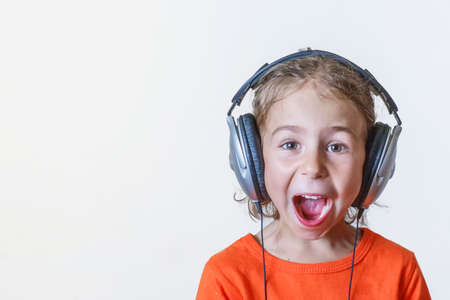 Girl in the headphones listens her favorite songの写真素材