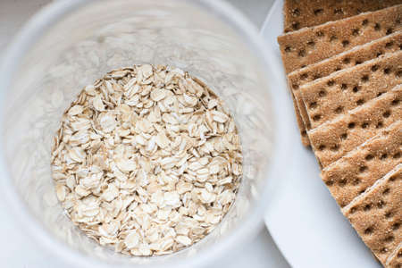Oatmeal in glass jars and thin crispbread. Healthy Breakfast. Healthy eatingの写真素材