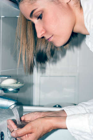 A beautiful girl is washing herself in the morning. Personal hygieneの写真素材